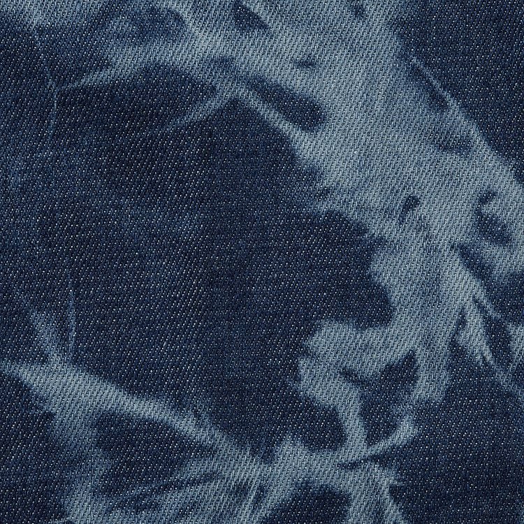 High-contrast faded pattern with retro ‘80s streetwear character.