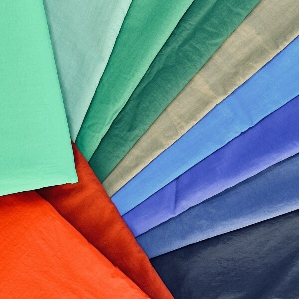 Wrinkled-surface fabric with a reflective sheen for a modern urban-tech look.