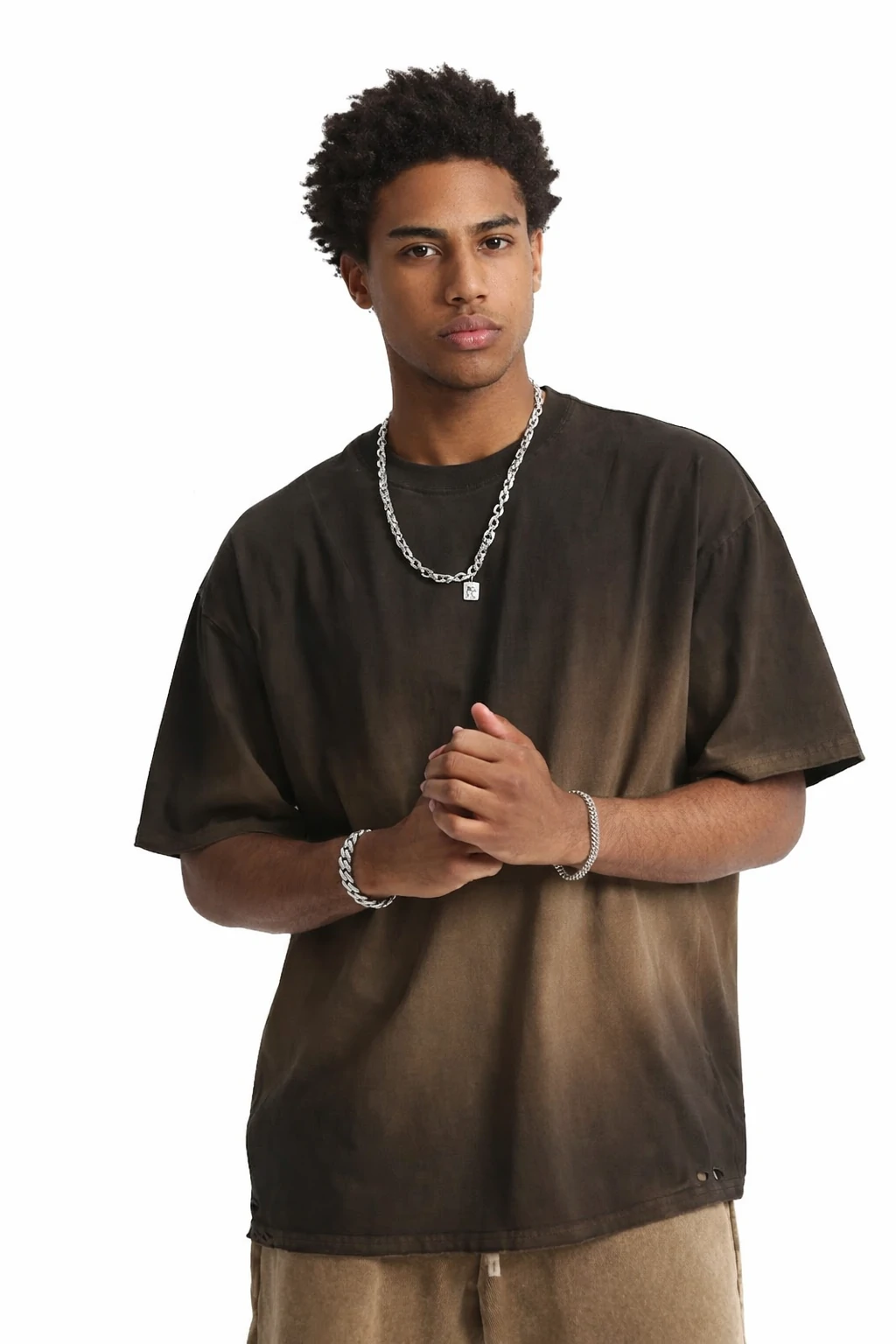 Oversized brown washed t-shirt featuring a relaxed fit, soft cotton fabric, and a vintage fade finish. Ideal for casual streetwear styling and everyday wear.